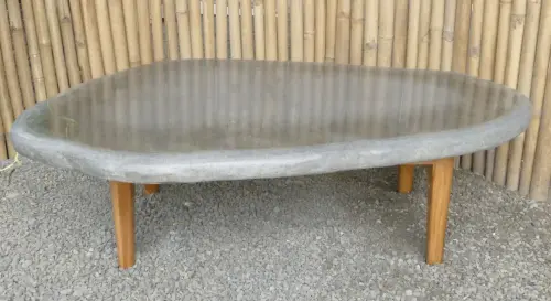Product image of the product “table made of riverstone with wooden feet. size approx. 129x84x38 cm ”